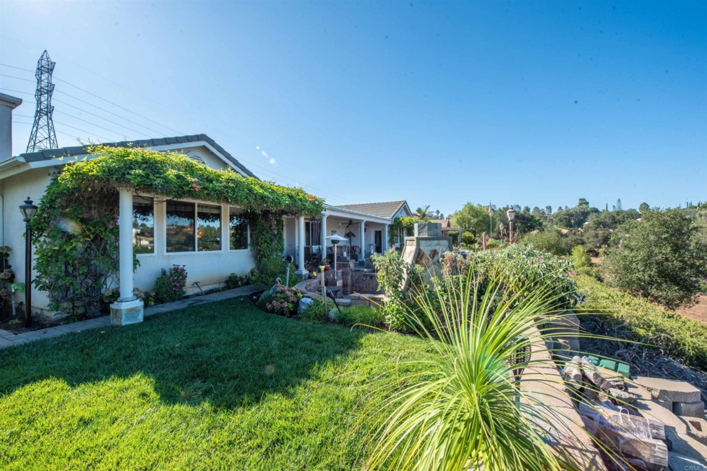 28288 Deep Canyon Drive Escondido, CA 92026 - Photo 67 of 75 a view of a house with a big yard plants and large trees