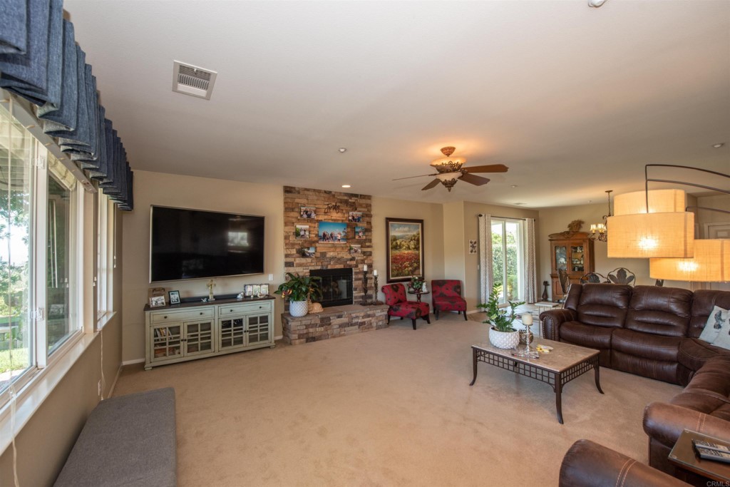 28288 Deep Canyon Drive Escondido, CA 92026 - Photo 10 of 75 a living room with furniture and a flat screen tv