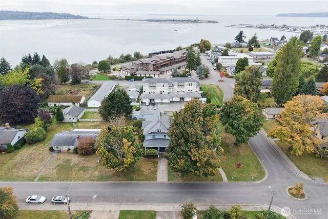 an aerial view of a residential building and lake view