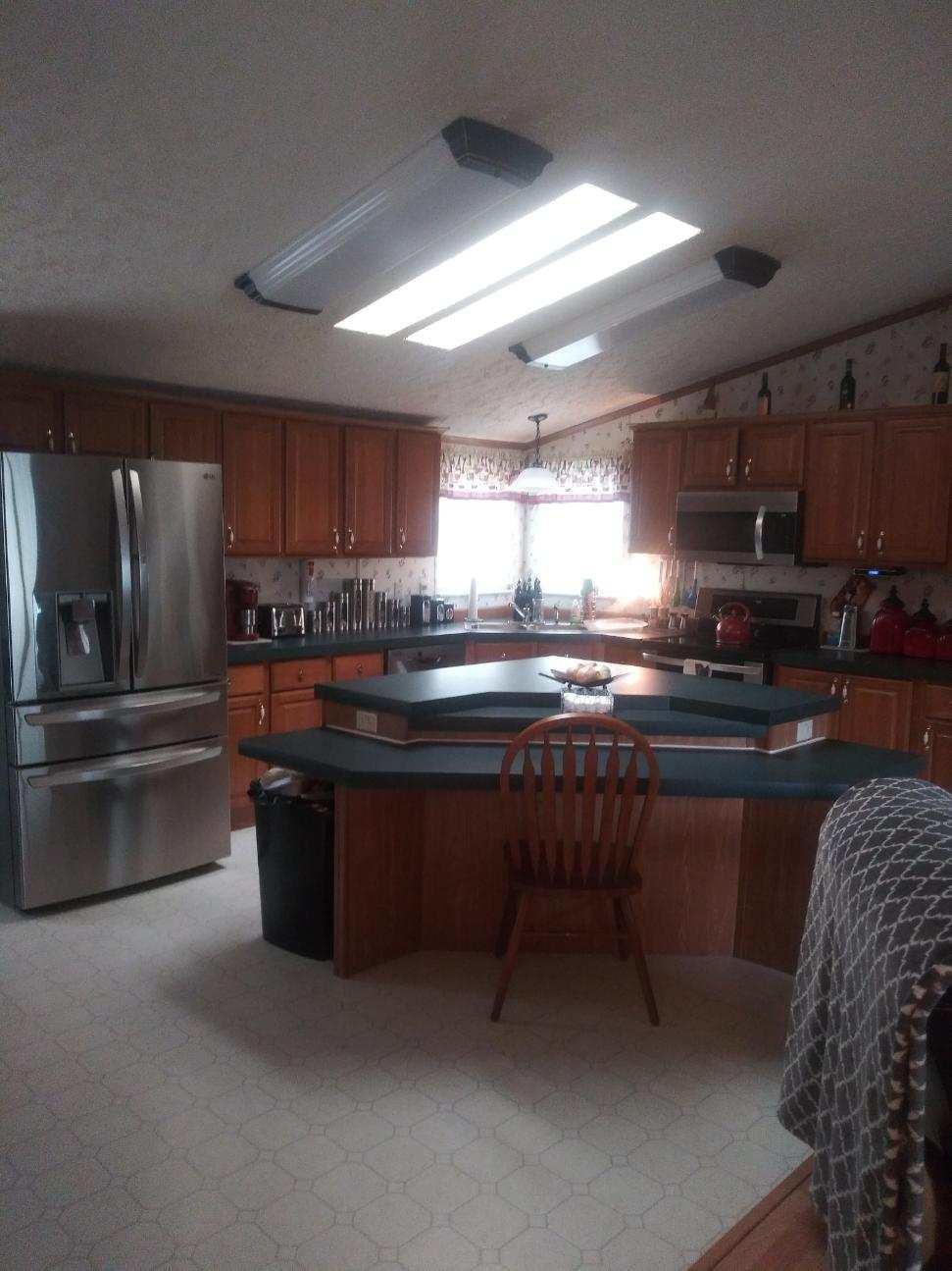2401 Reed Springs Road Philadelphia, TN 37846 - Photo 8 of 20 a kitchen with stainless steel appliances granite countertop a sink stove and refrigerator