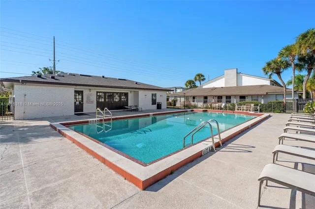 a view of a patio with a yard