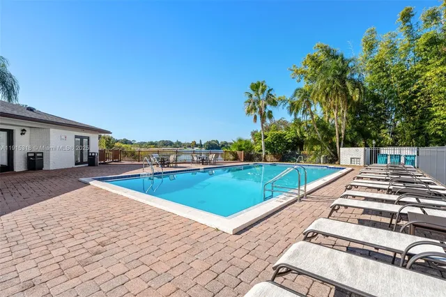 a view of a swimming pool with a lounge chair