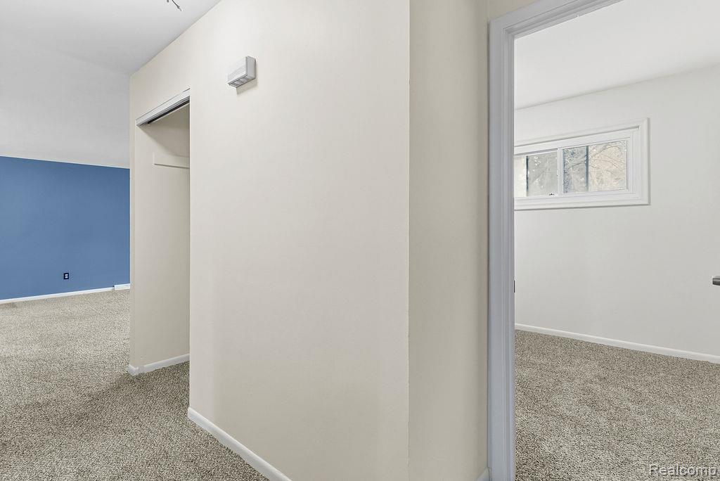 3485 Hammerberg Road Flint, MI 48507 - Photo 15 of 35 Corridor featuring light carpet