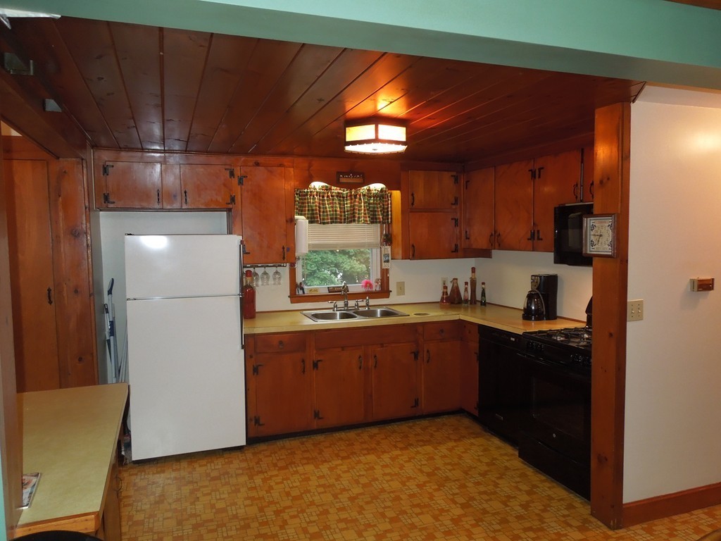 9 Meadowbrook Road Hudson, MA 01749 - Photo 7 of 18 a kitchen with stainless steel appliances granite countertop a refrigerator and a sink