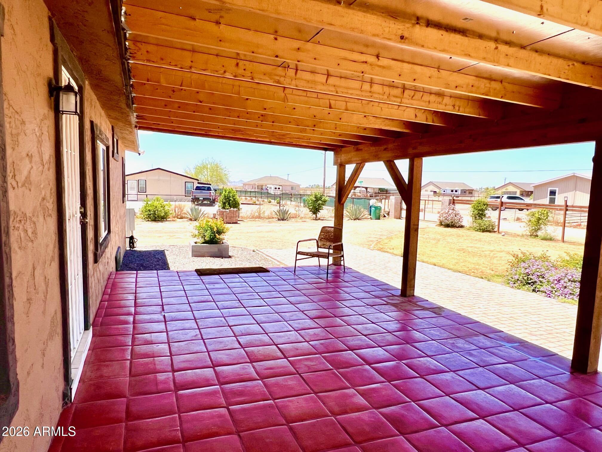 12035 East Tennyson Road Florence, AZ 85132 - Photo 29 of 42 a view of a porch with wooden floor and furniture