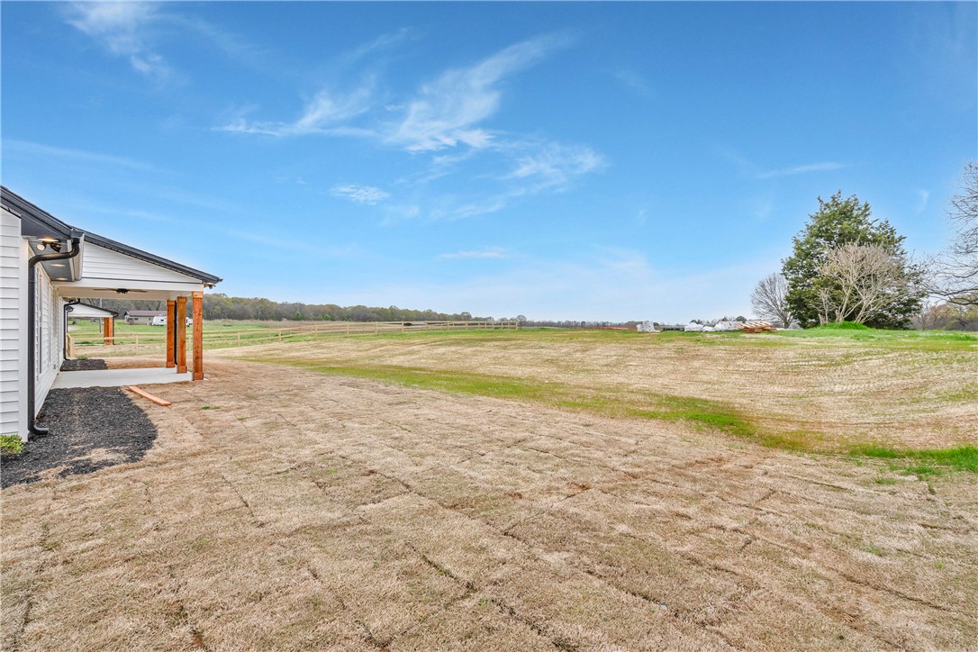 4554 Flat Rock Road Iva, SC 29655 - Photo 31 of 32 A spacious backyard with a newly installed sod lawn, ready for outdoor enjoyment.