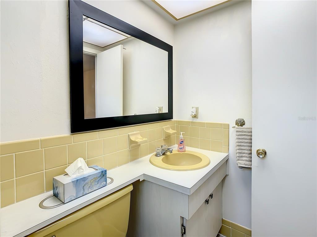 4230 Redcliff Place, Unit 4230 New Port Richey, FL 34652 - Photo 19 of 42 a bathroom with a sink and a mirror