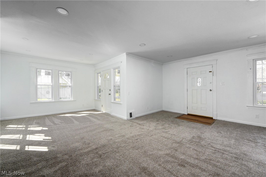 3164 Whitethorn Road Cleveland, OH 44118 - Photo 8 of 31 Unfurnished room with crown molding and light colored carpet