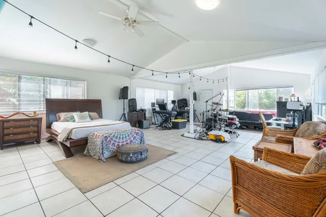 a bedroom with a bed and a table