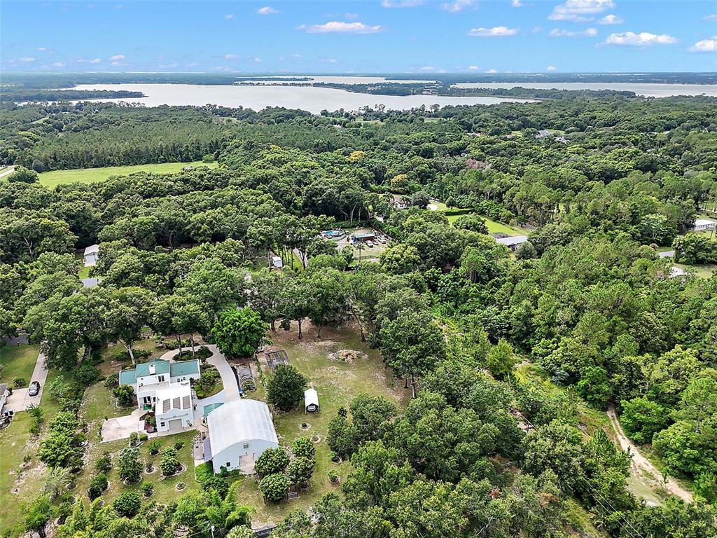 Allen St Mount Mount Dora, FL 32757 - Photo 10 of 14 an aerial view of a city with lots of residential buildings ocean and mountain view in back