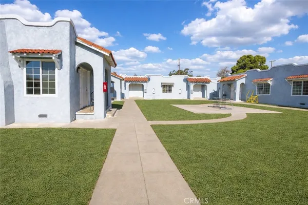 a front view of house and yard with green space
