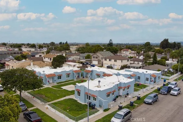 an aerial view of residential houses with outdoor space