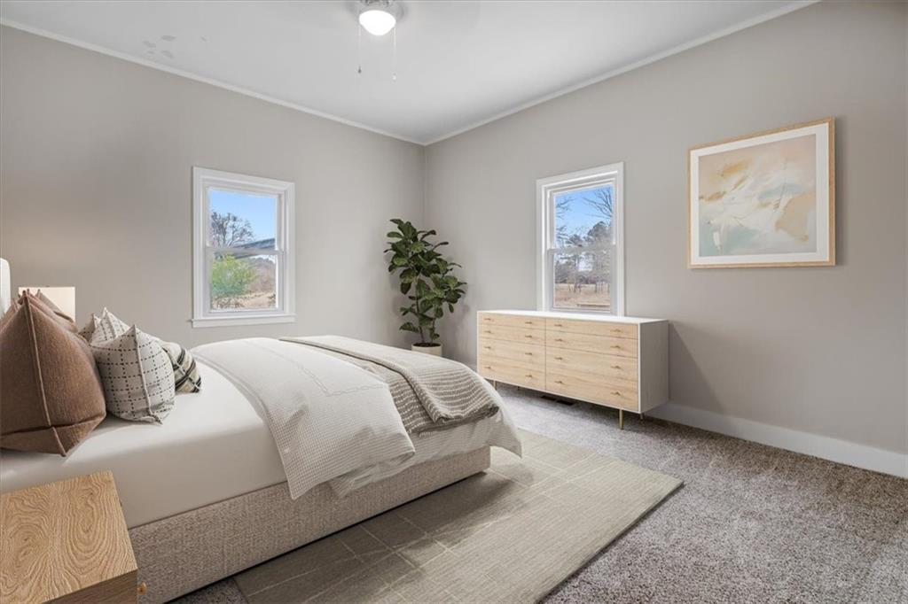 292 Ervin Coker Road Northeast Rome, GA 30161 - Photo 12 of 29 a bedroom with a large bed and a window