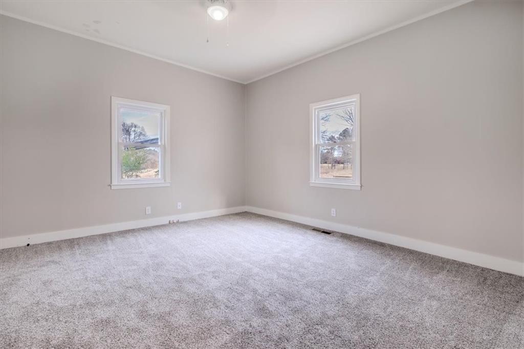 292 Ervin Coker Road Northeast Rome, GA 30161 - Photo 13 of 29 an empty room with windows