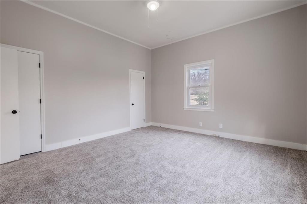 292 Ervin Coker Road Northeast Rome, GA 30161 - Photo 14 of 29 a view of an empty room with a window