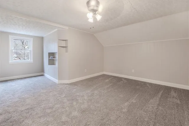 a view of an empty room with a bathroom