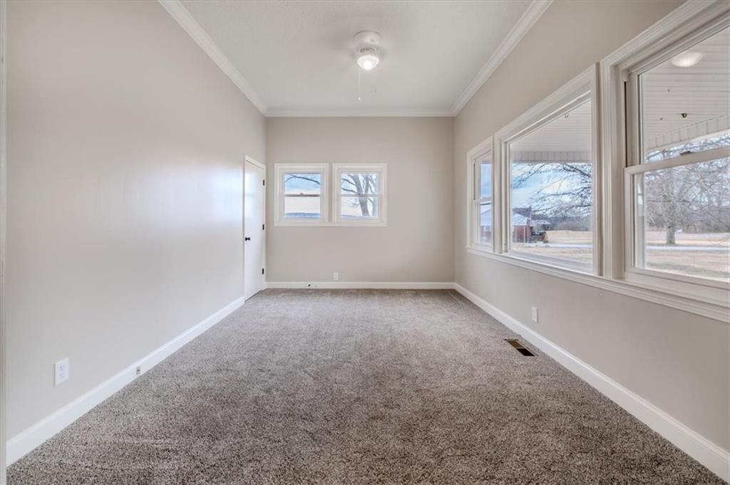 292 Ervin Coker Road Northeast Rome, GA 30161 - Photo 6 of 29 wooden floor in an empty room with a window