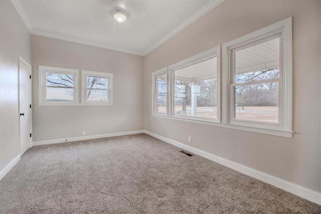 292 Ervin Coker Road Northeast Rome, GA 30161 - Photo 8 of 29 an empty room with windows