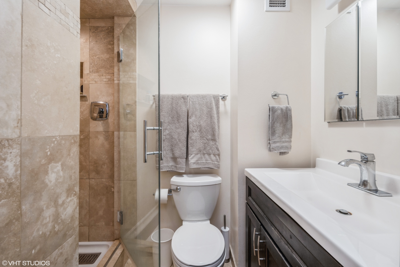2605 South Indiana Avenue, Unit 1201 Chicago, IL 60616 - Photo 11 of 18 a bathroom with a toilet a sink and shower