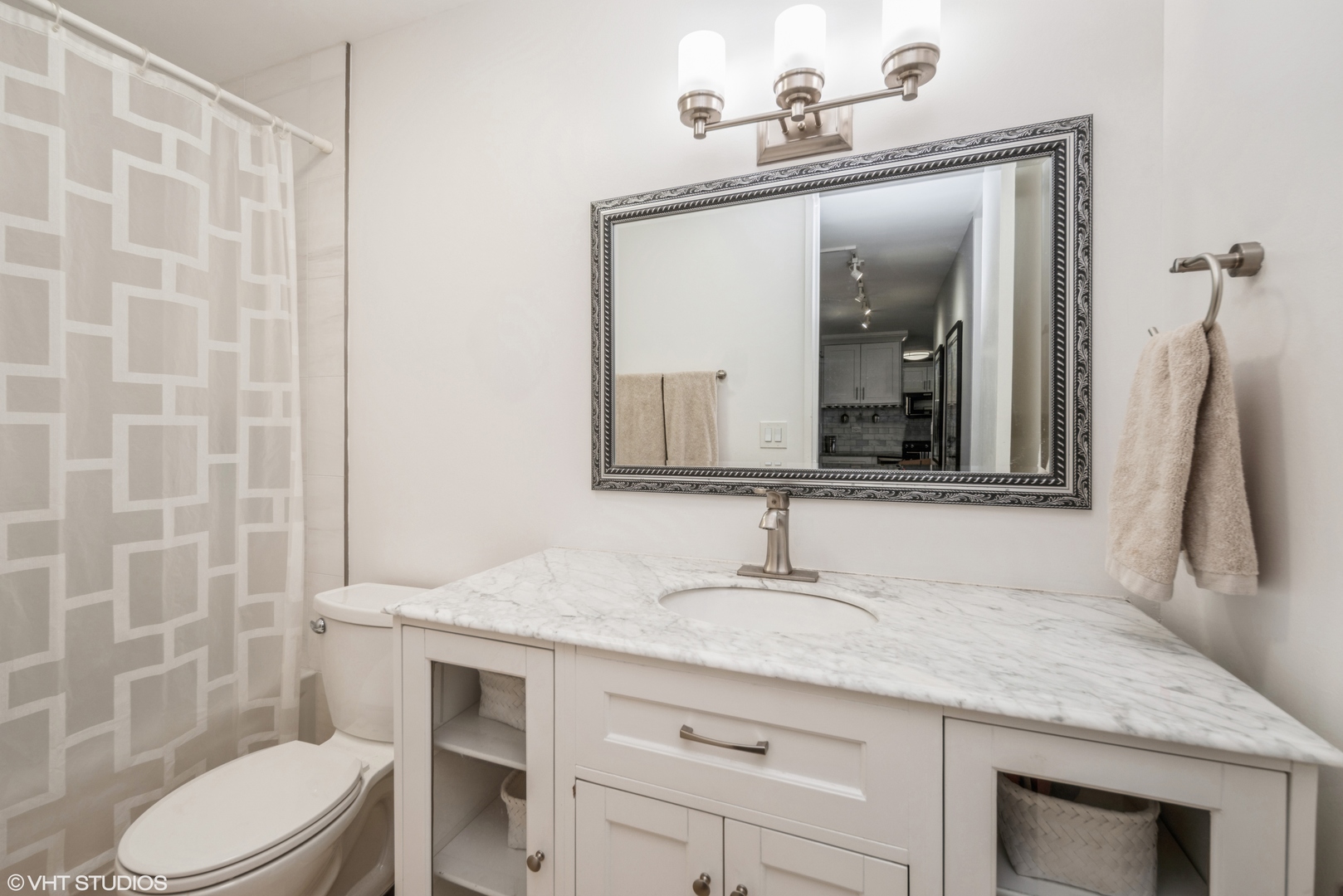 2605 South Indiana Avenue, Unit 1201 Chicago, IL 60616 - Photo 14 of 18 a bathroom with a granite countertop sink vanity mirror and toilet