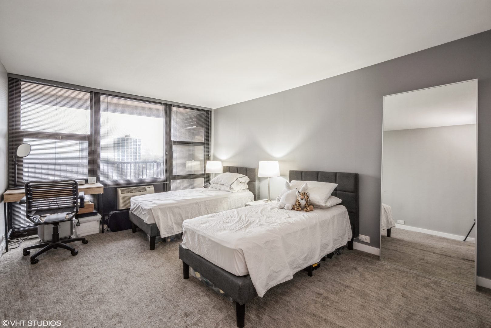 2605 South Indiana Avenue, Unit 1201 Chicago, IL 60616 - Photo 15 of 18 a bedroom with bed and large windows