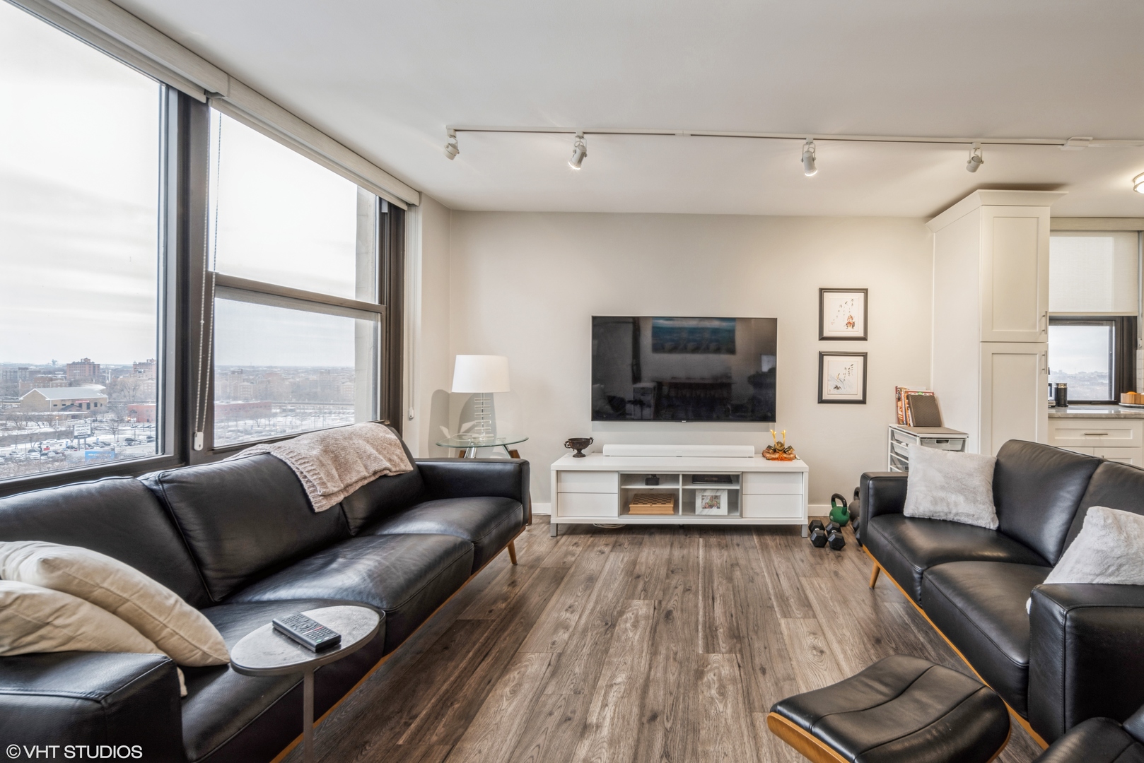 2605 South Indiana Avenue, Unit 1201 Chicago, IL 60616 - Photo 4 of 18 a living room with furniture and a flat screen tv