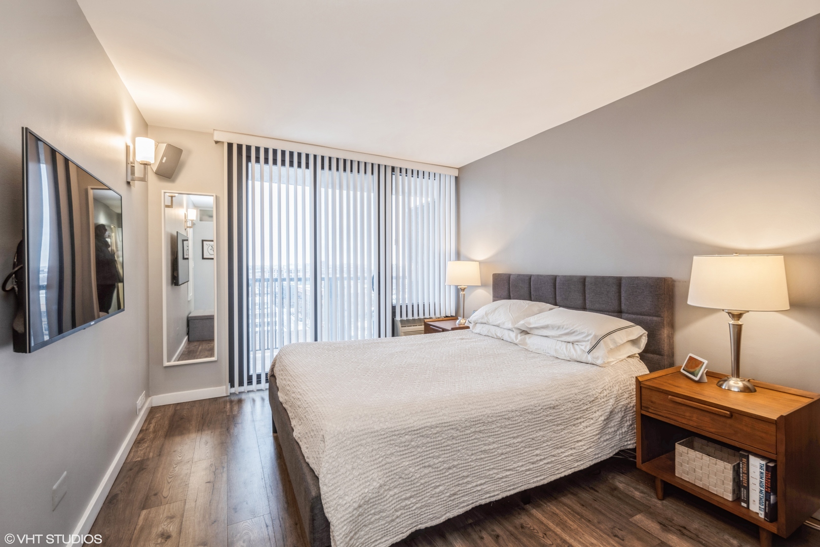2605 South Indiana Avenue, Unit 1201 Chicago, IL 60616 - Photo 8 of 18 a bedroom with a bed and a night stand