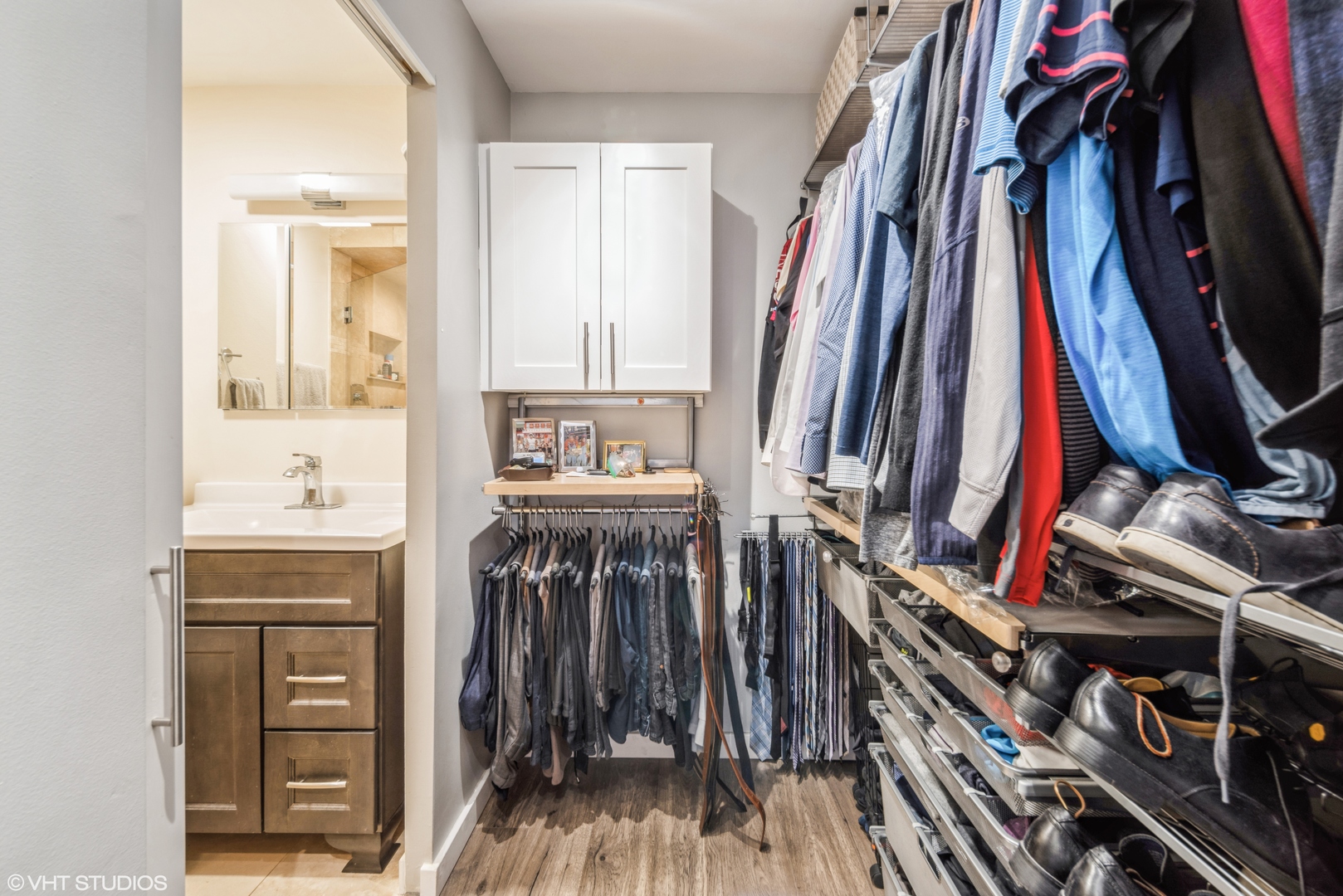 2605 South Indiana Avenue, Unit 1201 Chicago, IL 60616 - Photo 10 of 18 a view of walk in closet with clothes and shoes