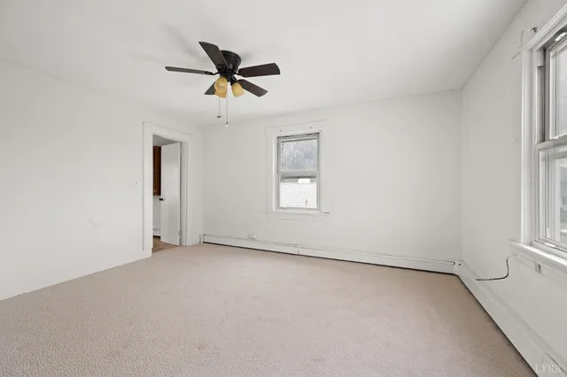 a view of an empty room and window