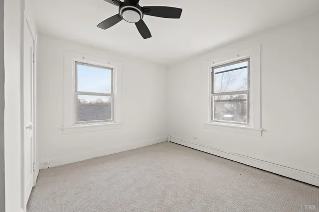 a view of a room that has a window in it