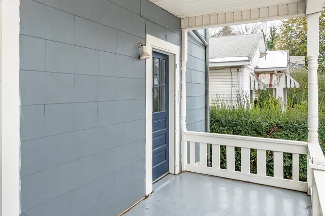 a view of a balcony with wooden fence