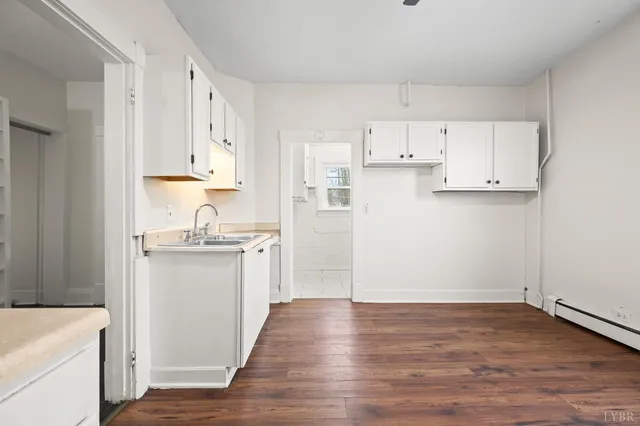 a view of kitchen with wooden floor