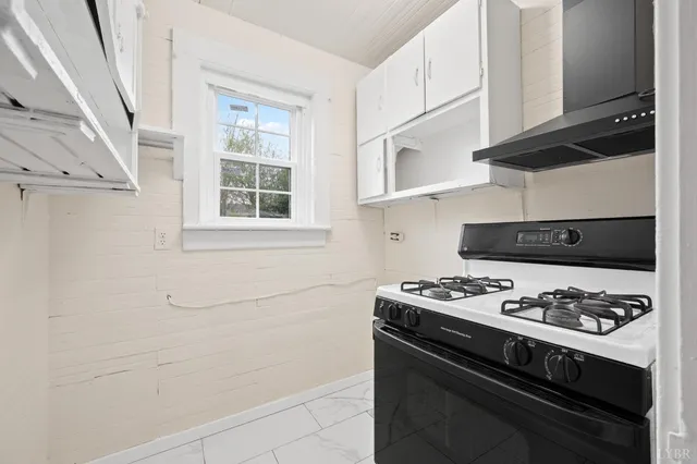 a kitchen with stainless steel appliances a stove and a refrigerator