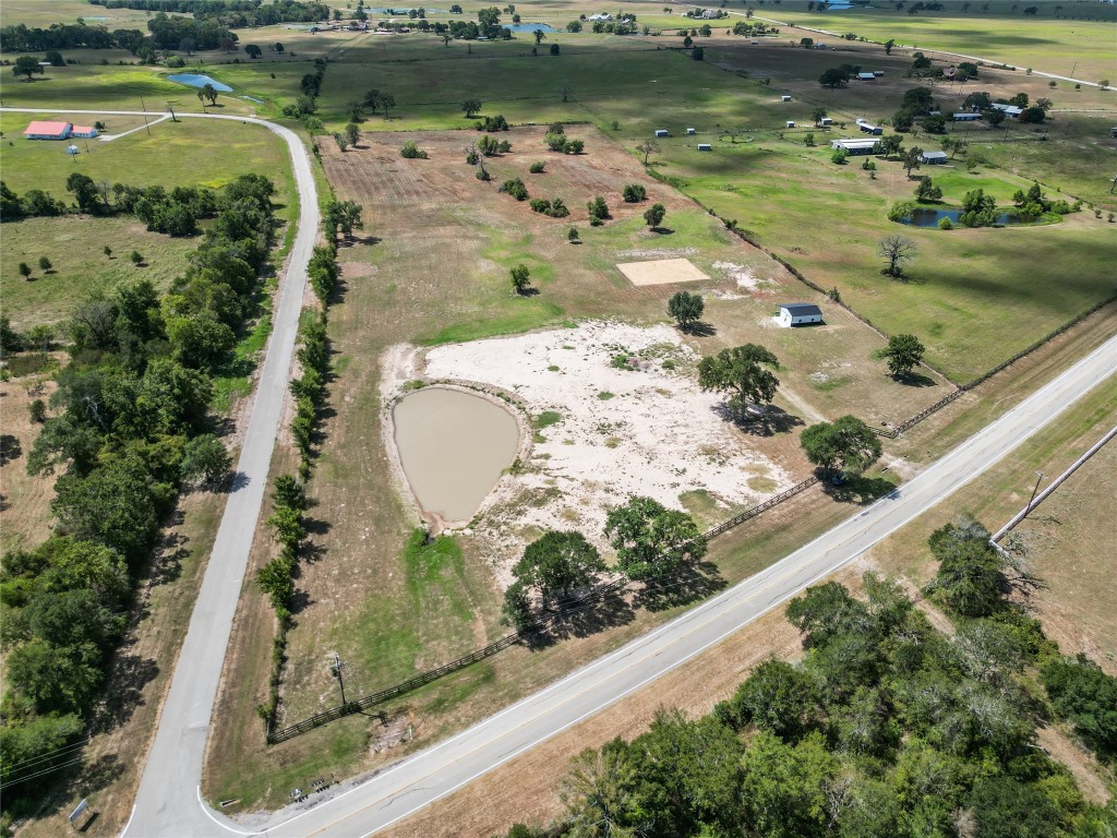 33083 Fm 1736 Road Hempstead, TX 77445 - Photo 12 of 20 an aerial view of a house with a lake view