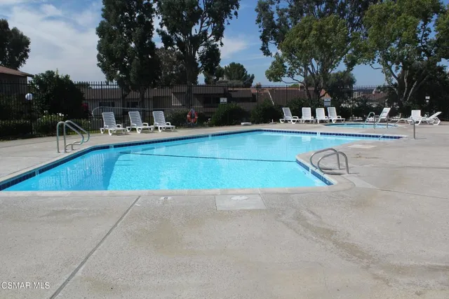 a view of a swimming pool with a patio