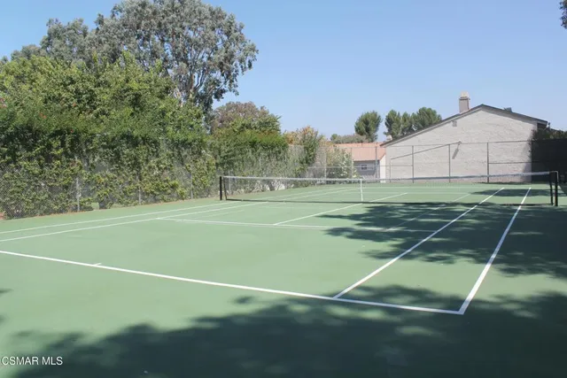 a view of a wrought iron fences in front of house