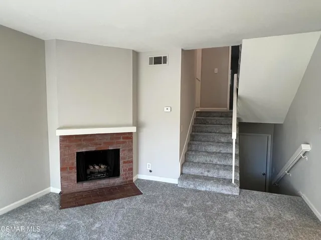 a view of a livingroom with a fireplace