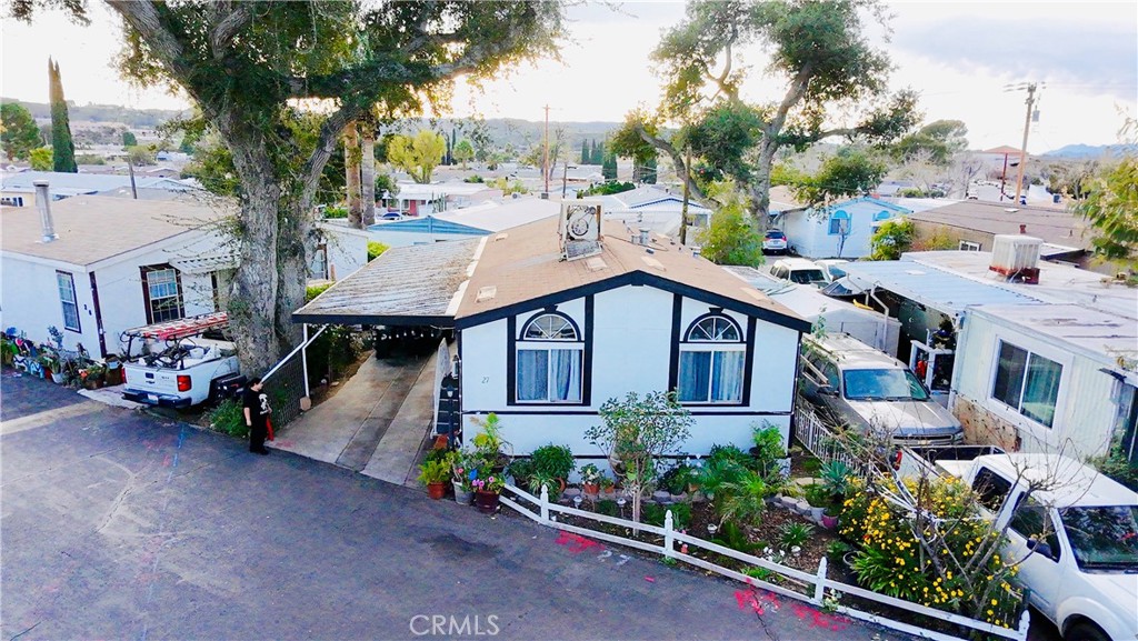 a view of a house with a garden and pathway