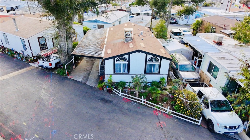 18540 Soledad Canyon Road, Unit 27 Canyon Country, CA 91351 - Photo 2 of 34 an aerial view of a house with a yard and potted plants
