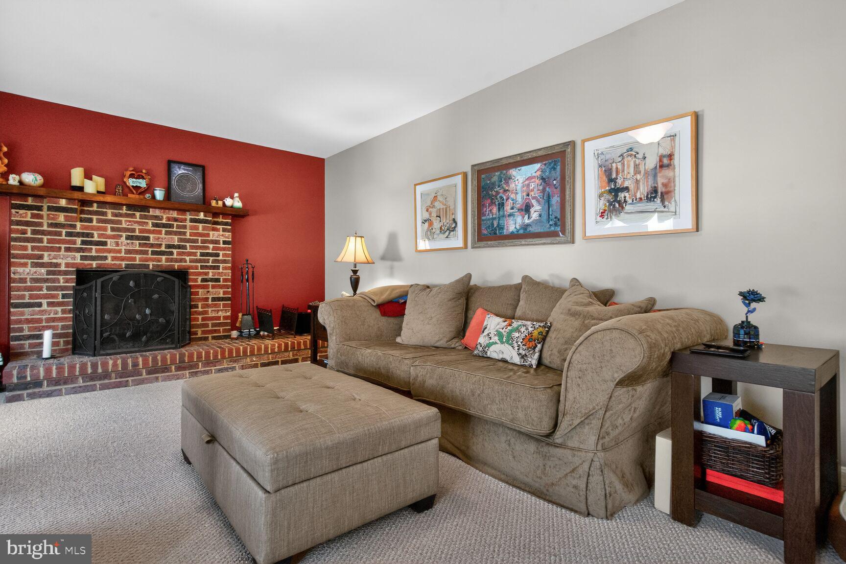 2036 Mayflower Drive Silver Spring, MD 20905 - Photo 14 of 48 a living room with furniture and a fireplace