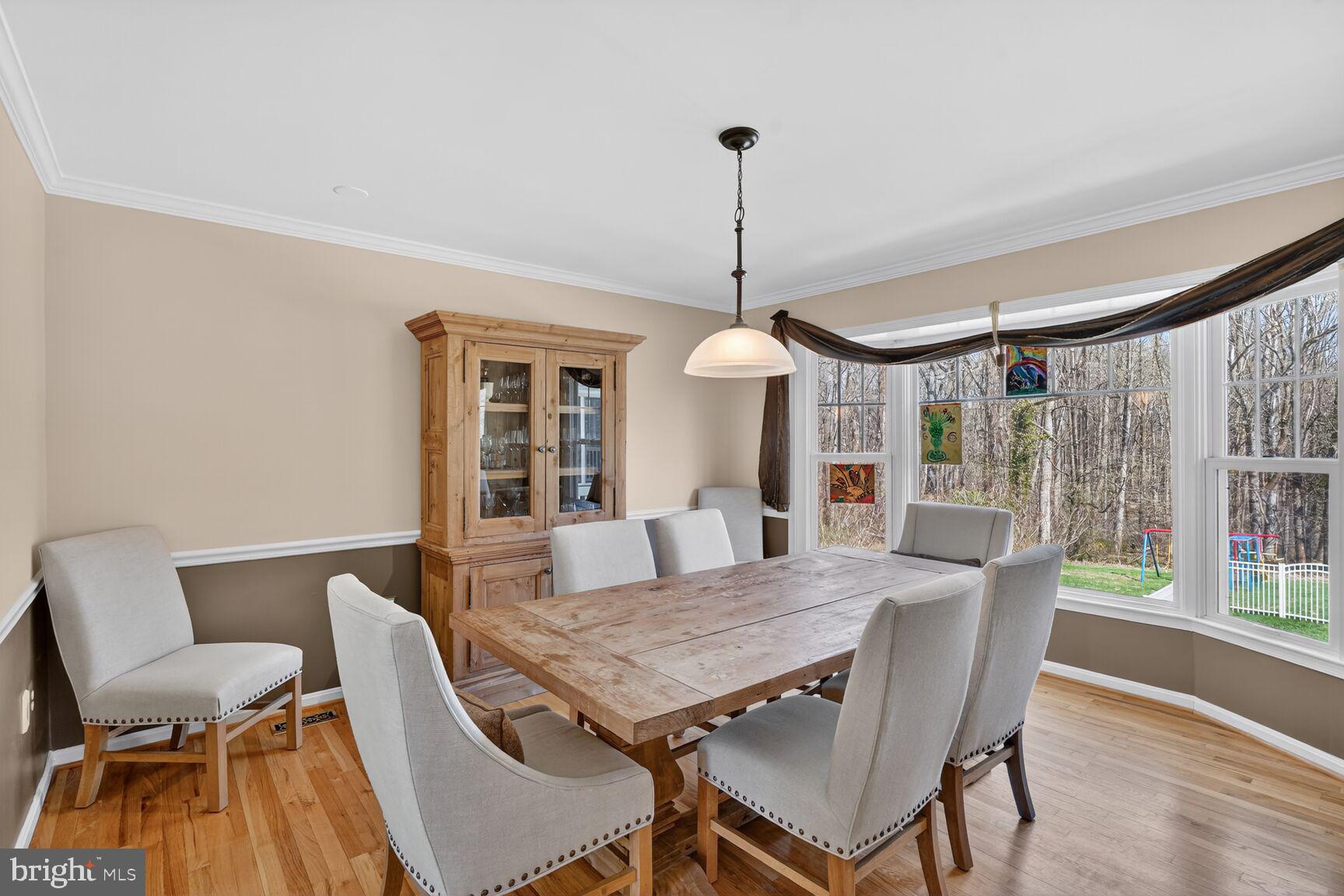 2036 Mayflower Drive Silver Spring, MD 20905 - Photo 17 of 48 a view of a dining room with furniture window and wooden floor
