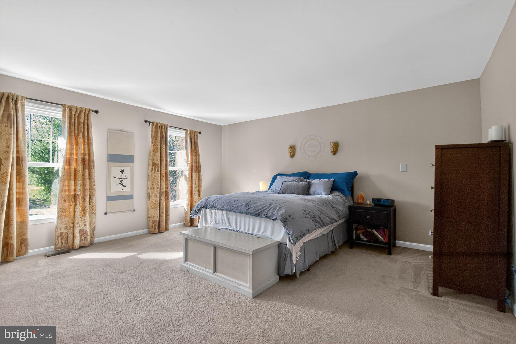 2036 Mayflower Drive Silver Spring, MD 20905 - Photo 22 of 48 a bedroom with a bed and a refrigerator