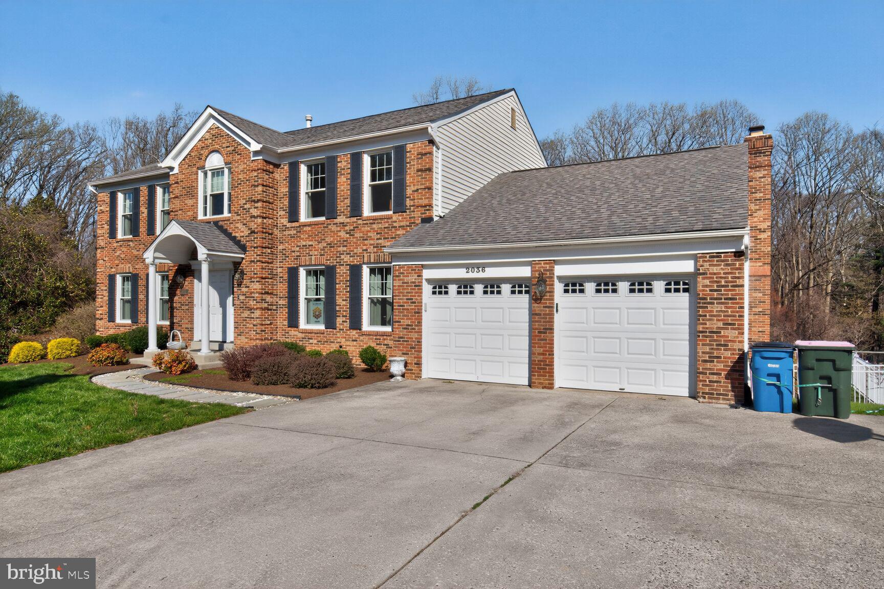 2036 Mayflower Drive Silver Spring, MD 20905 - Photo 3 of 48 a front view of a house with a yard and garage