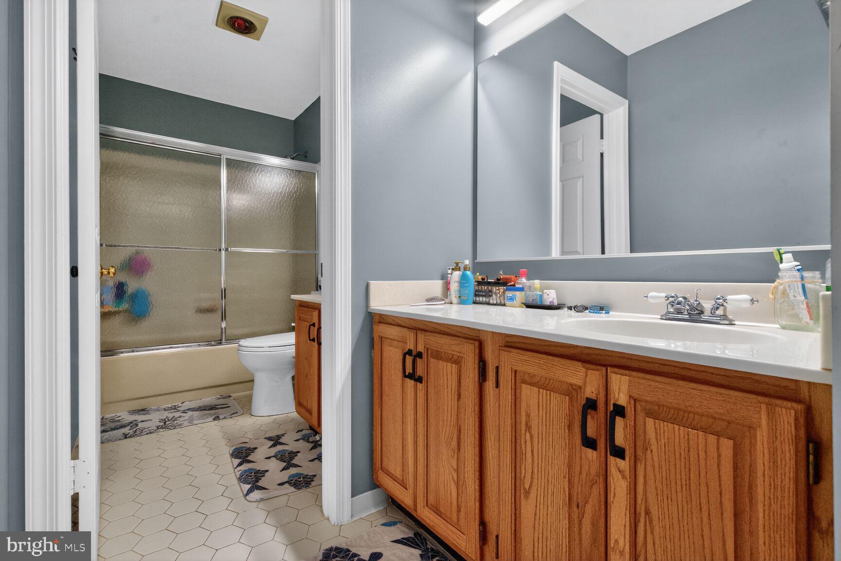 2036 Mayflower Drive Silver Spring, MD 20905 - Photo 40 of 48 a bathroom with a sink double vanity and a bathtub