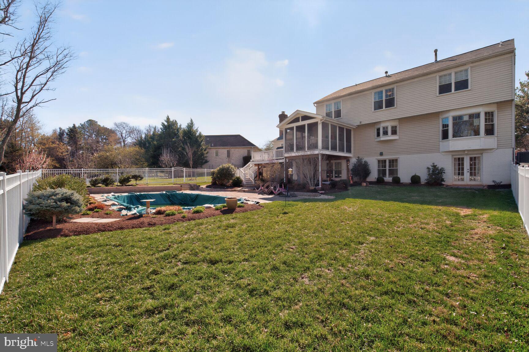 2036 Mayflower Drive Silver Spring, MD 20905 - Photo 43 of 48 a view of a house with a big yard and sitting area