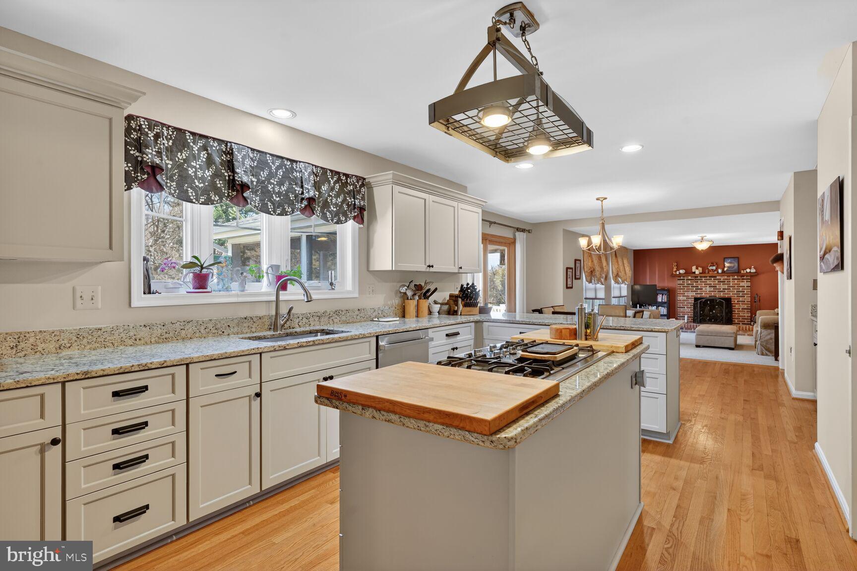2036 Mayflower Drive Silver Spring, MD 20905 - Photo 7 of 48 a kitchen with a sink stainless steel appliances a large window and cabinets