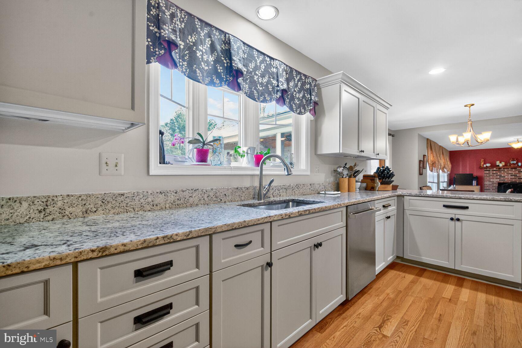 2036 Mayflower Drive Silver Spring, MD 20905 - Photo 9 of 48 a kitchen with white cabinets and sink