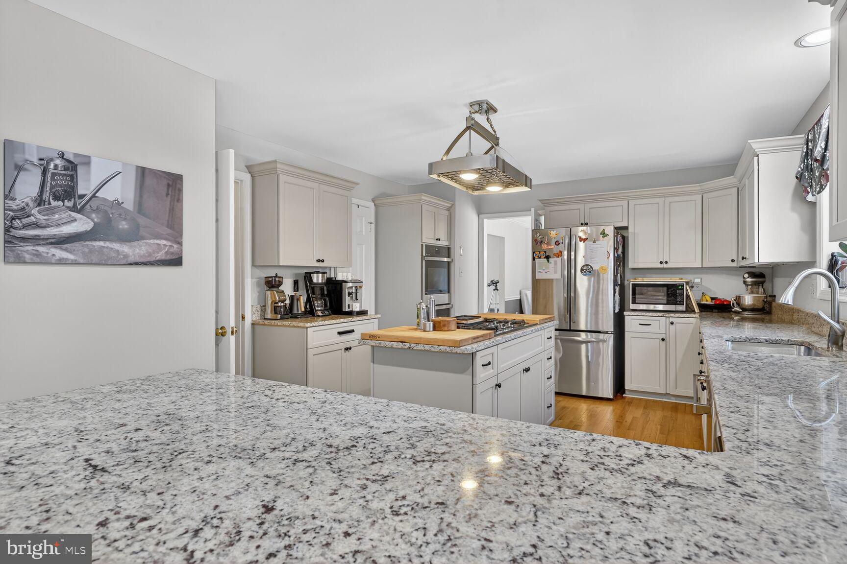 2036 Mayflower Drive Silver Spring, MD 20905 - Photo 10 of 48 a kitchen with refrigerator and window