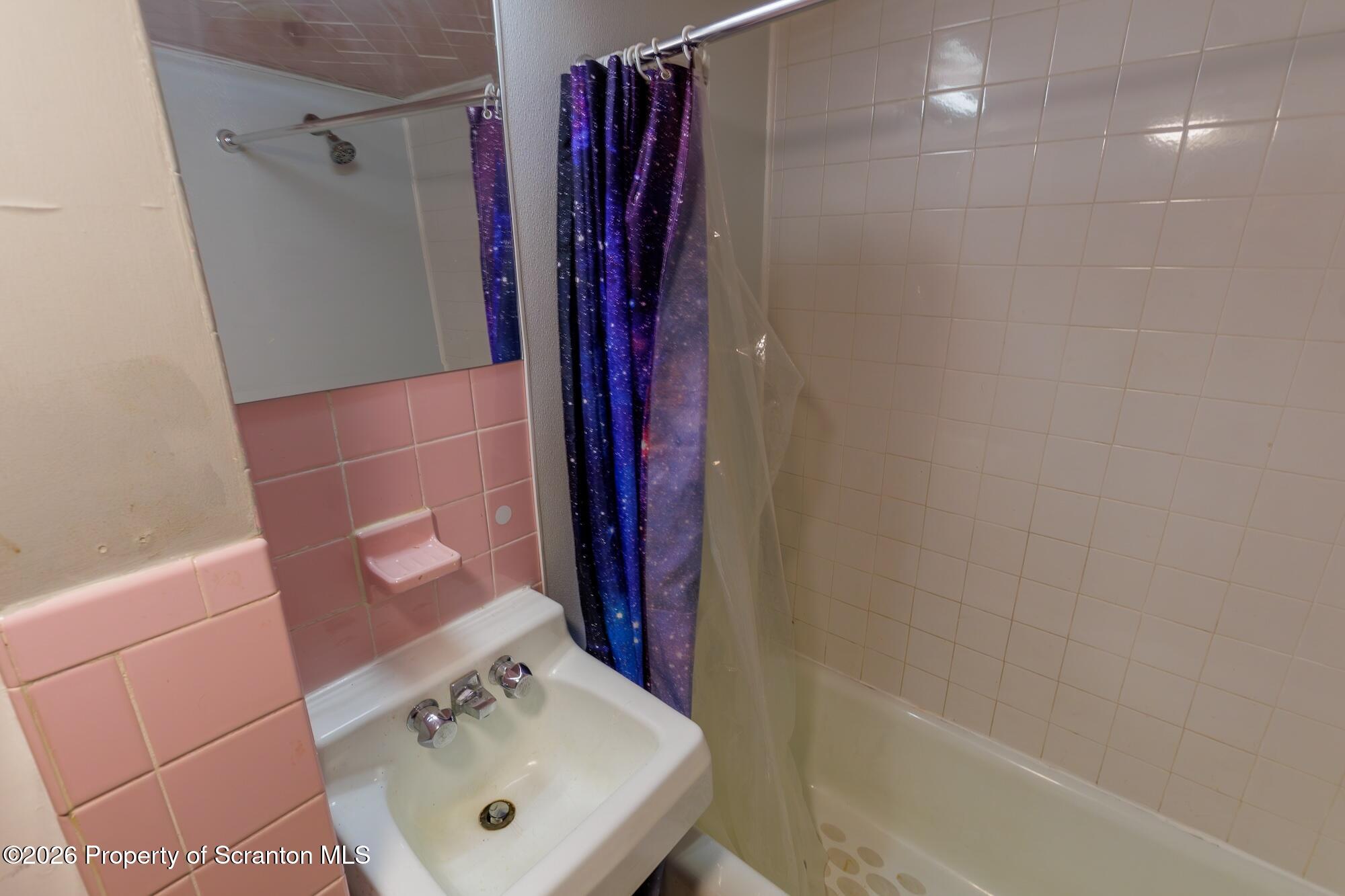 623 East Elm Street, Unit 1 Scranton, PA 18505 - Photo 11 of 15 a bathroom with a sink a toilet and shower