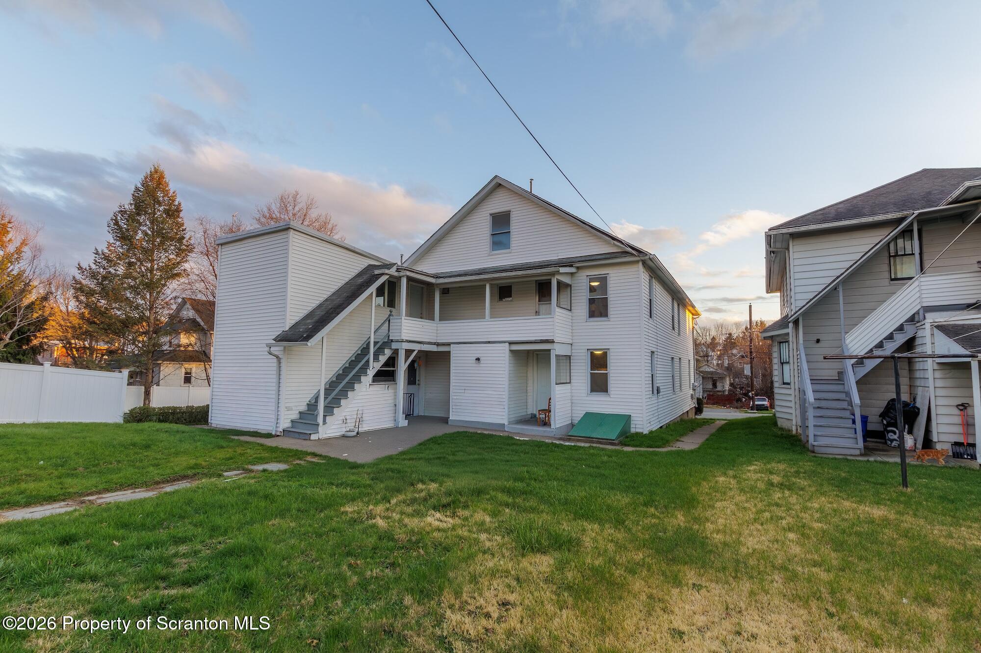 623 East Elm Street, Unit 1 Scranton, PA 18505 - Photo 14 of 15 a front view of house with yard and green space